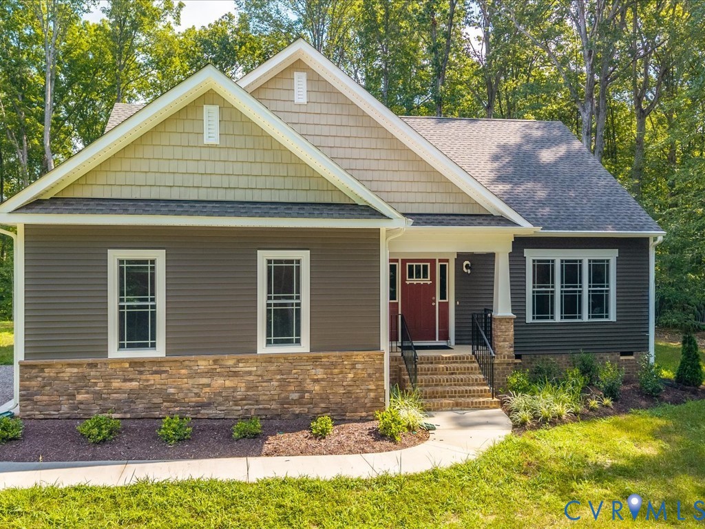 1146 Clayton Road Powhatan, VA 23139 - Photo 2 of 42 a front view of a house with garden