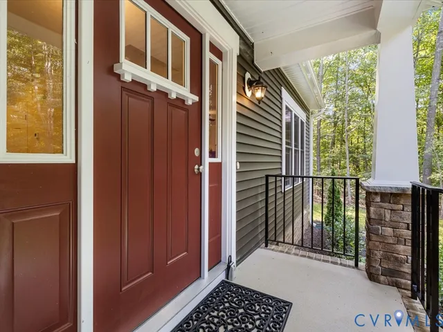 a view of a house with a door and wooden floor