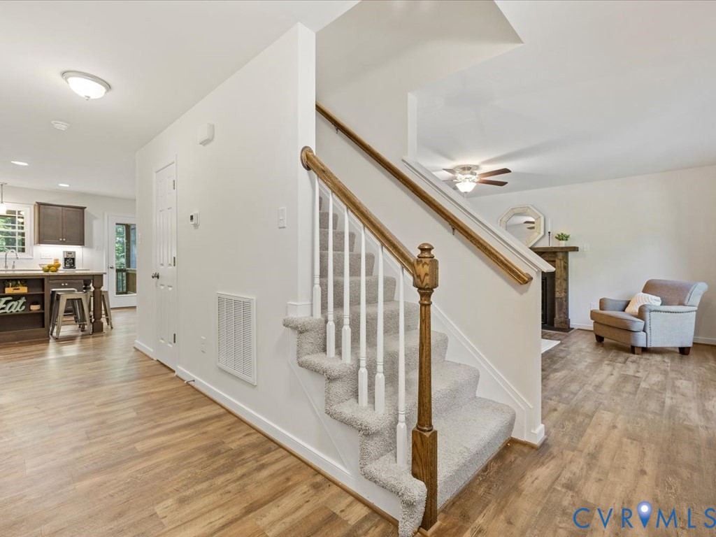 1146 Clayton Road Powhatan, VA 23139 - Photo 6 of 42 a view of a livingroom with furniture and stairs
