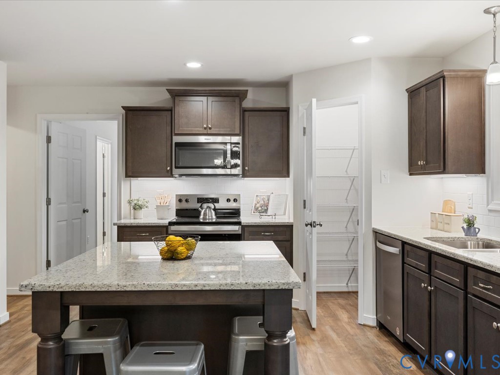 1146 Clayton Road Powhatan, VA 23139 - Photo 8 of 42 a kitchen with a sink a counter space appliances and cabinets