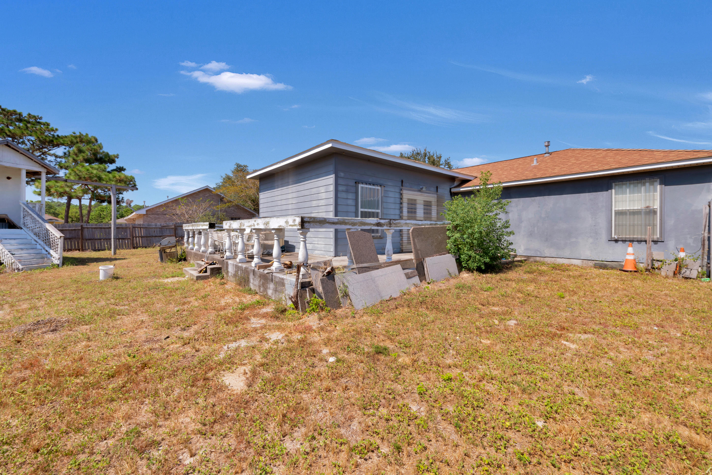 8757 Laredo Street Navarre, FL 32566 - Photo 12 of 14 a view of a house with table and chairs in patio