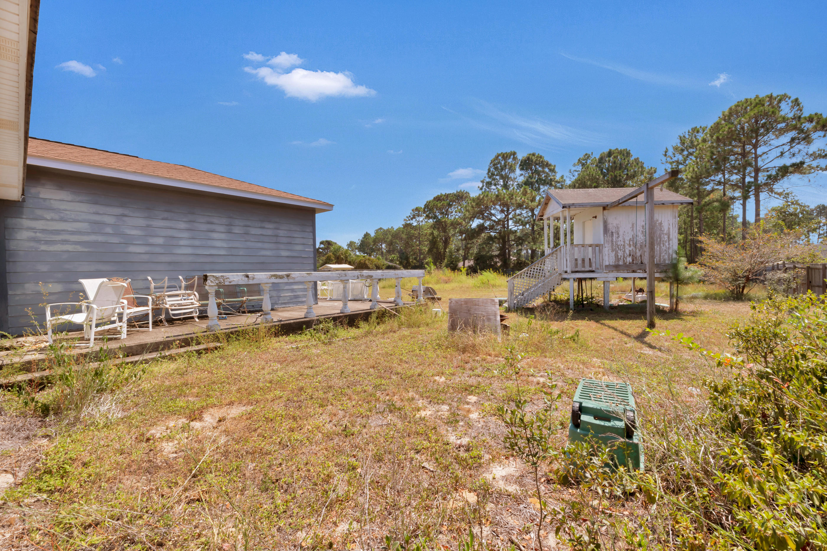 8757 Laredo Street Navarre, FL 32566 - Photo 14 of 14 a swimming pool with outdoor seating