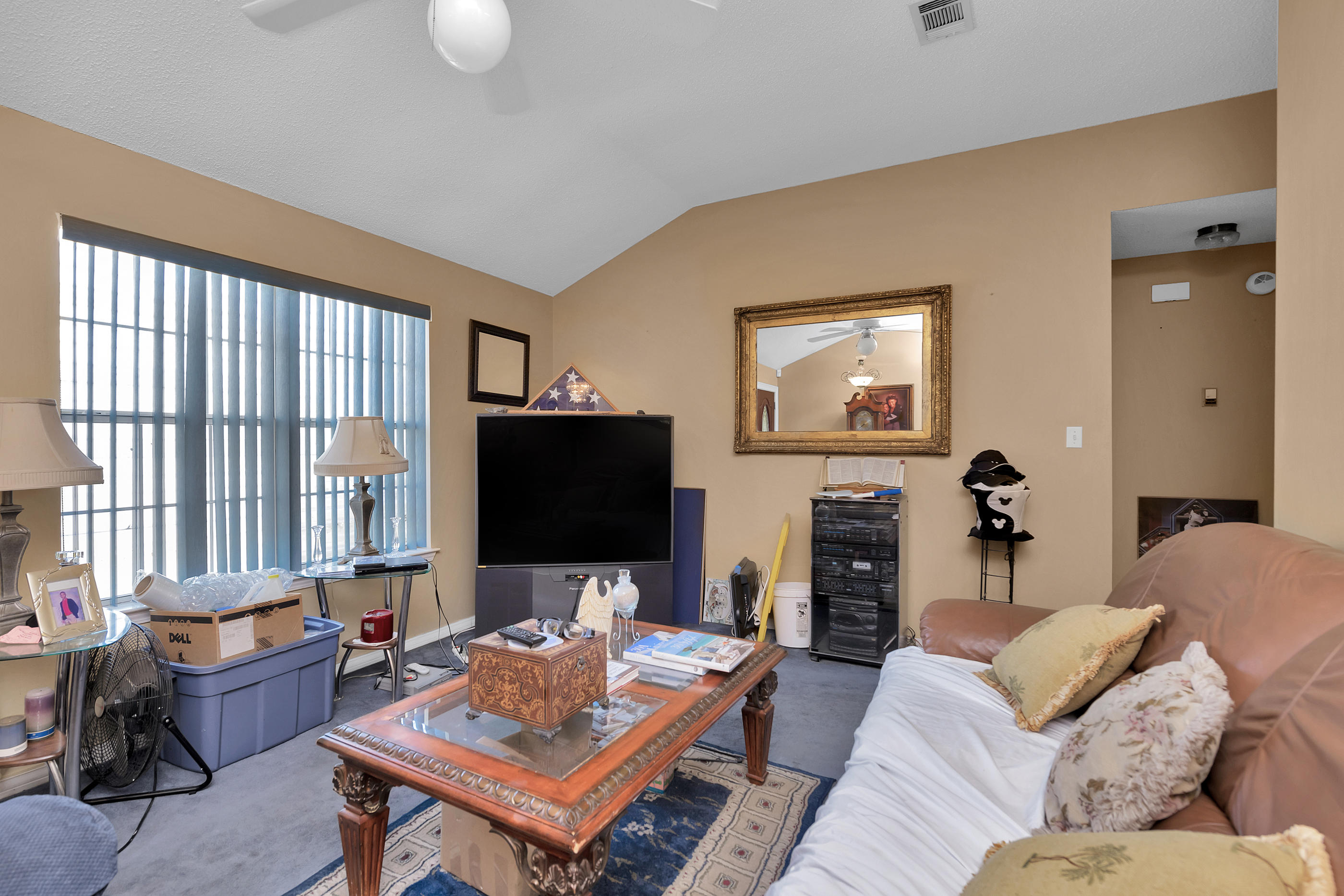 8757 Laredo Street Navarre, FL 32566 - Photo 3 of 14 a living room with furniture and a flat screen tv