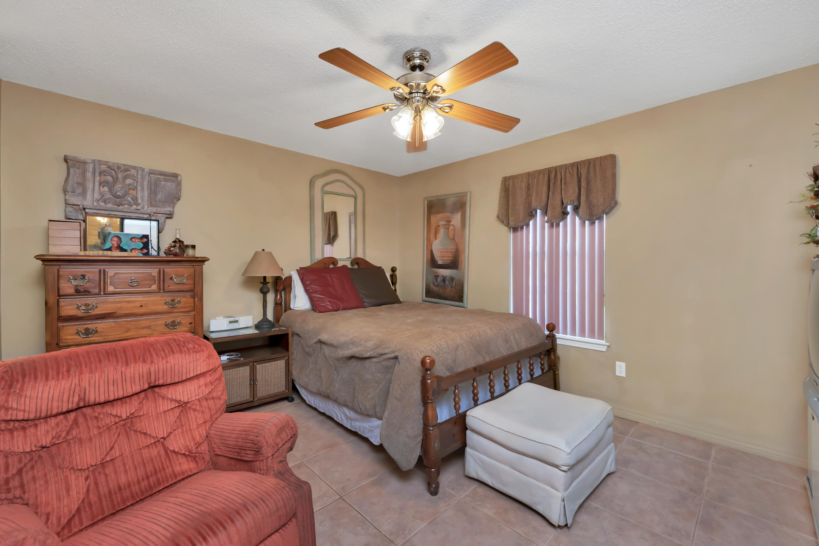 8757 Laredo Street Navarre, FL 32566 - Photo 8 of 14 a spacious bedroom with a bed and window