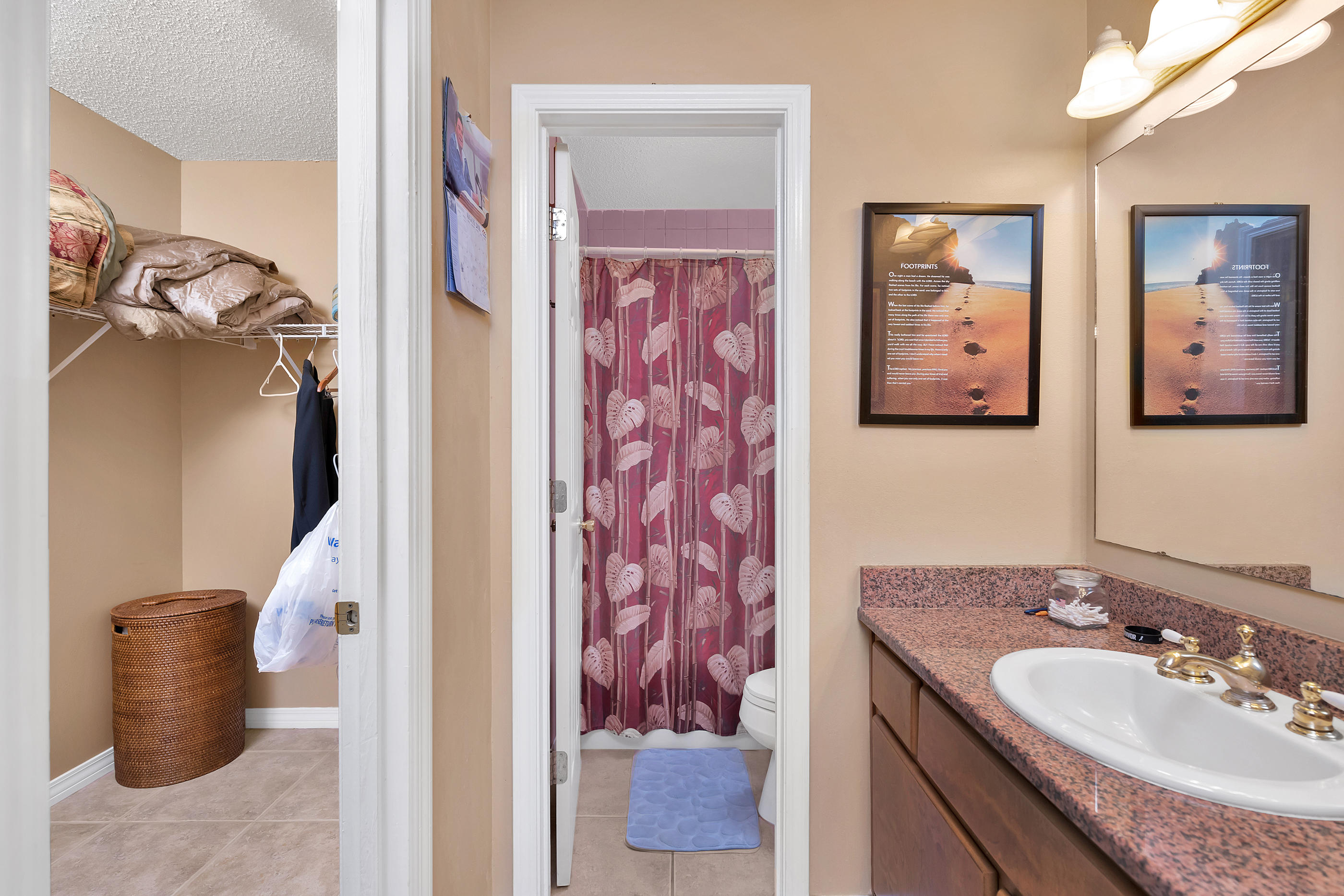8757 Laredo Street Navarre, FL 32566 - Photo 10 of 14 a bathroom with a sink and a mirror