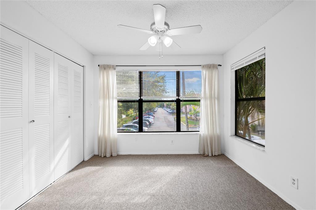 2736 South University Drive, Unit 1204 Davie, FL 33328 - Photo 14 of 23 an empty room with windows and cabinet