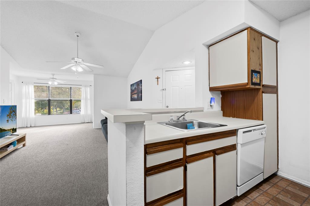 2736 South University Drive, Unit 1204 Davie, FL 33328 - Photo 15 of 23 a kitchen with a sink cabinets and window