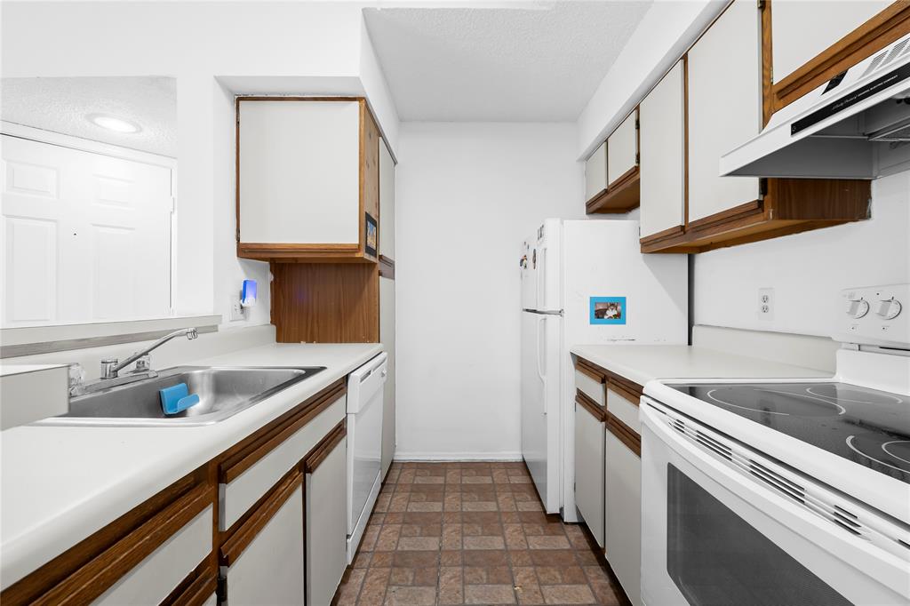 2736 South University Drive, Unit 1204 Davie, FL 33328 - Photo 16 of 23 a kitchen with a sink and cabinets