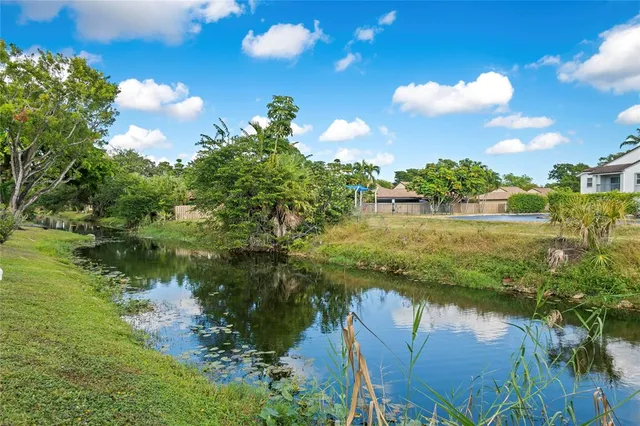 a view of lake with green space