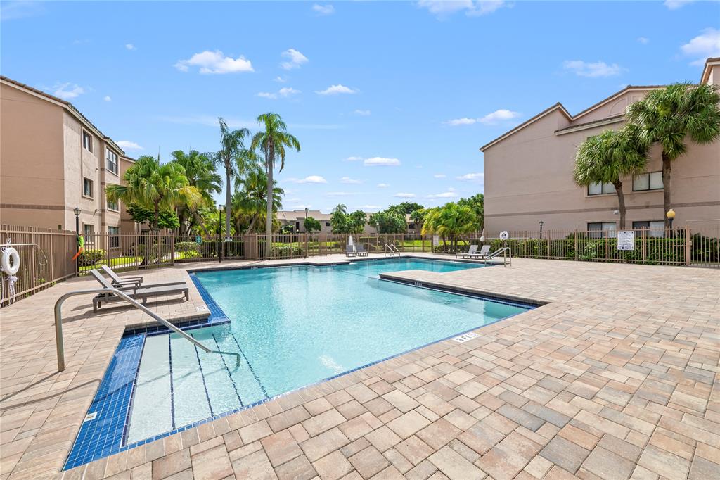 2736 South University Drive, Unit 1204 Davie, FL 33328 - Photo 3 of 23 a view of a lake with chairs