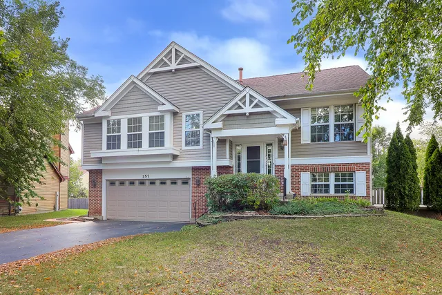 front view of a house with a yard