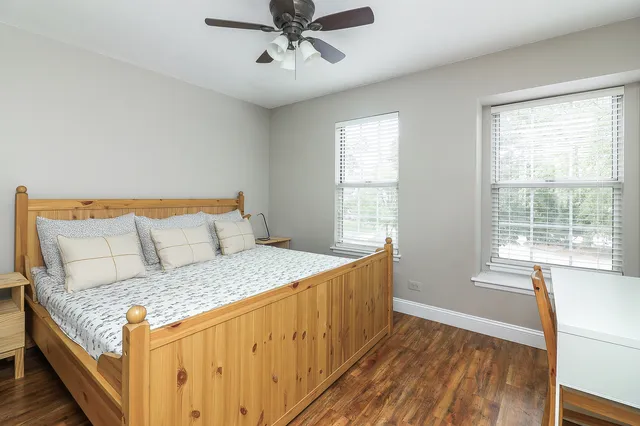 a bedroom with a large bed and a window