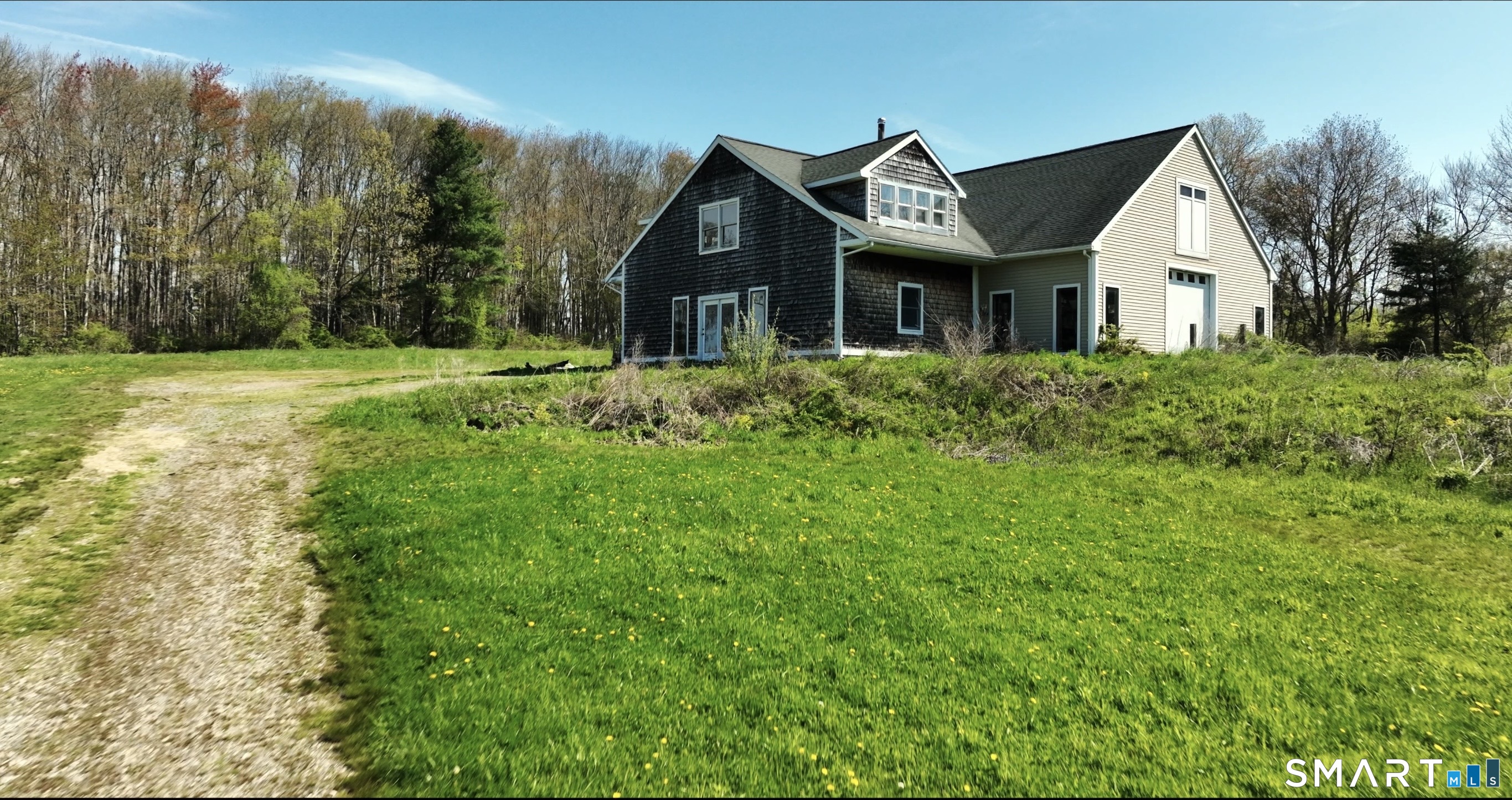 33 Meehan Road Woodstock, CT 06281 - Photo 28 of 39 Picturesque barn/garage with weathered cedar shingles and dramatic gabled design.