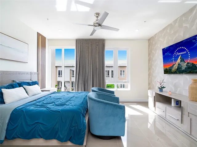 a bedroom with a bed and a couch