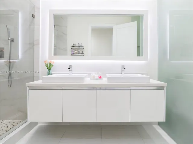 a bathroom with a sink vanity and a mirror