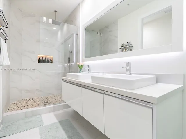 a bathroom with a sink a vanity and a mirror