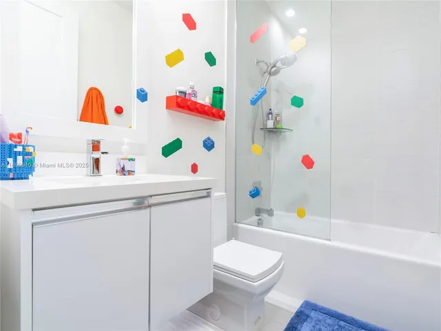 a bathroom with a sink a toilet and a bathtub