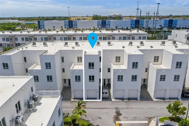 a large white building with a view of city