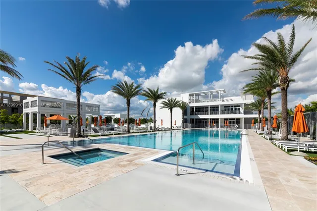 a view of swimming pool with outdoor seating