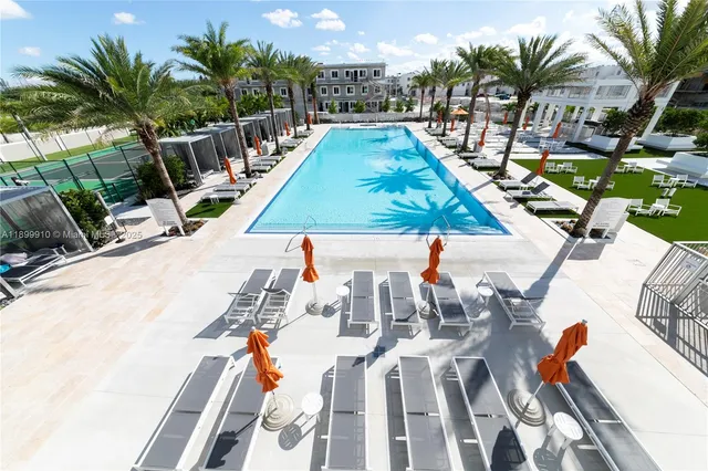 a view of swimming pool with outdoor seating