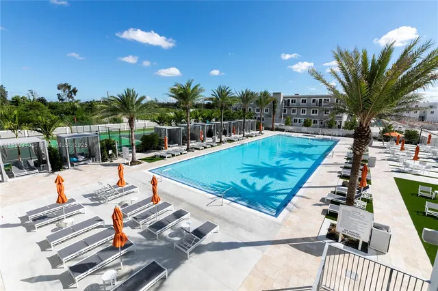 a view of swimming pool with chairs
