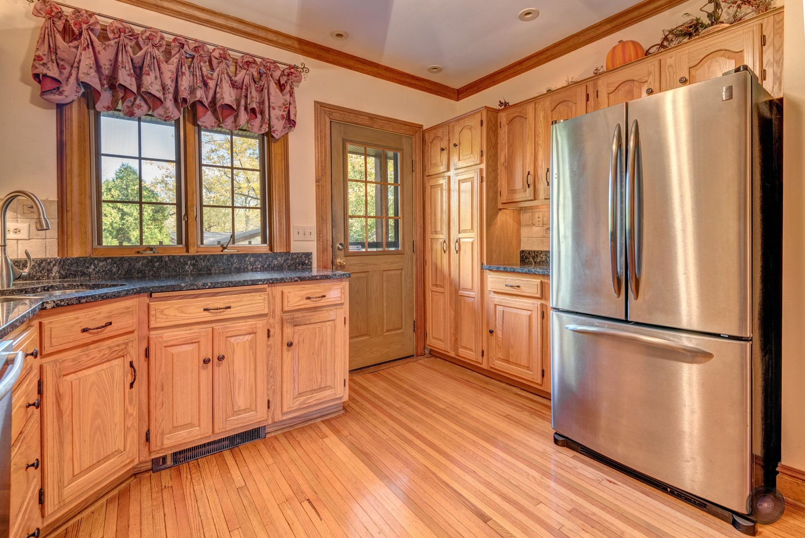 933 North Main Street Glen Ellyn, IL 60137 - Photo 14 of 32 a kitchen with stainless steel appliances granite countertop a refrigerator a sink and white cabinets