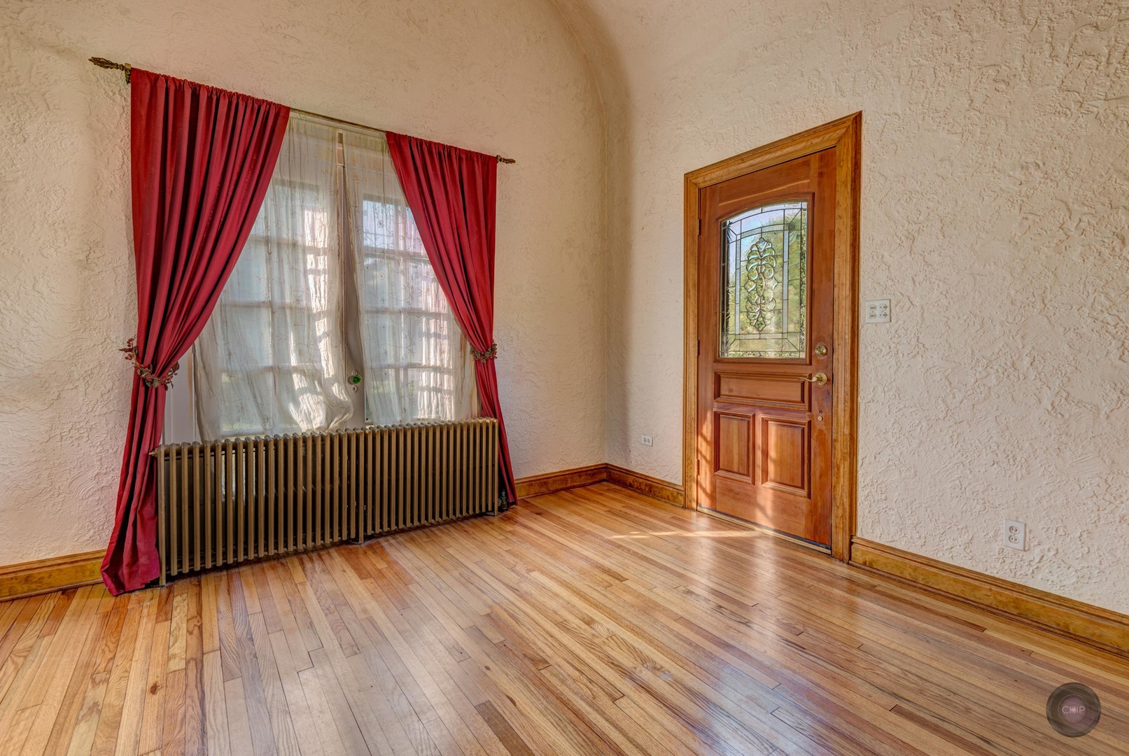 933 North Main Street Glen Ellyn, IL 60137 - Photo 3 of 32 an empty room with wooden floor and windows