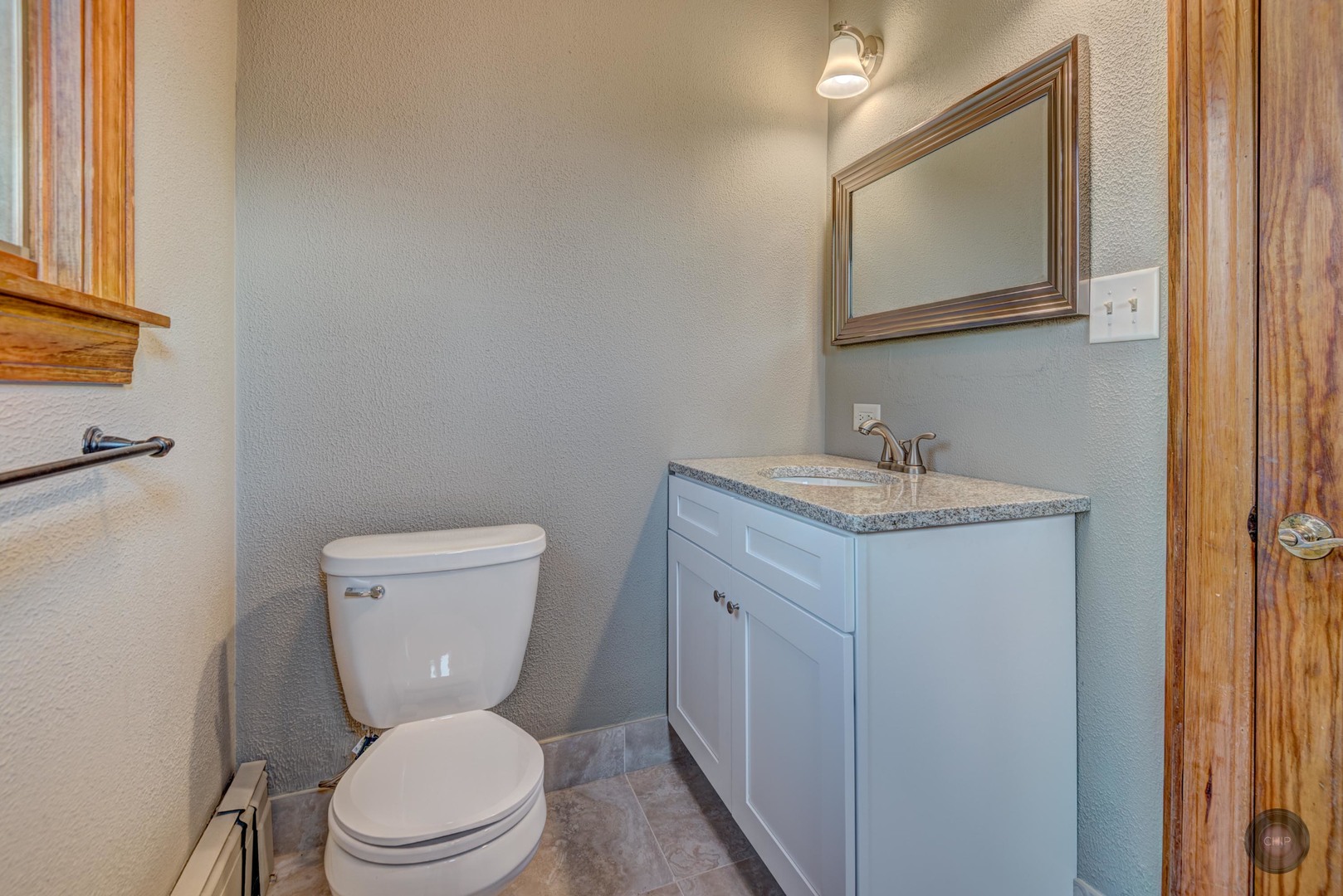 933 North Main Street Glen Ellyn, IL 60137 - Photo 23 of 32 a white toilet sitting next to a bathroom sink