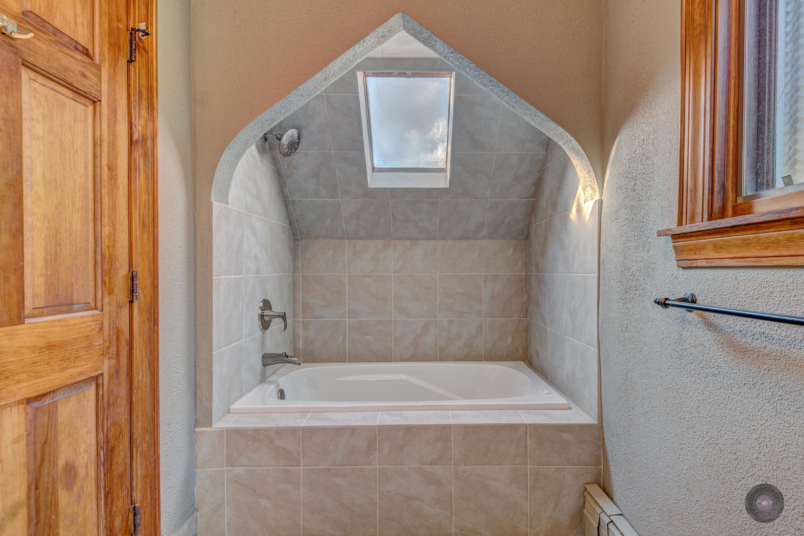 933 North Main Street Glen Ellyn, IL 60137 - Photo 24 of 32 a bathroom with a tub and shower