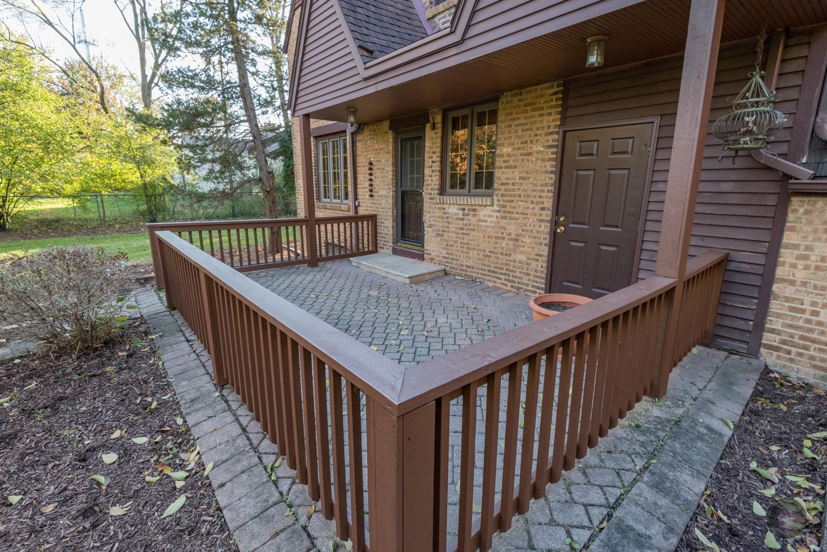 933 North Main Street Glen Ellyn, IL 60137 - Photo 29 of 32 a view of balcony with wooden floor and fence