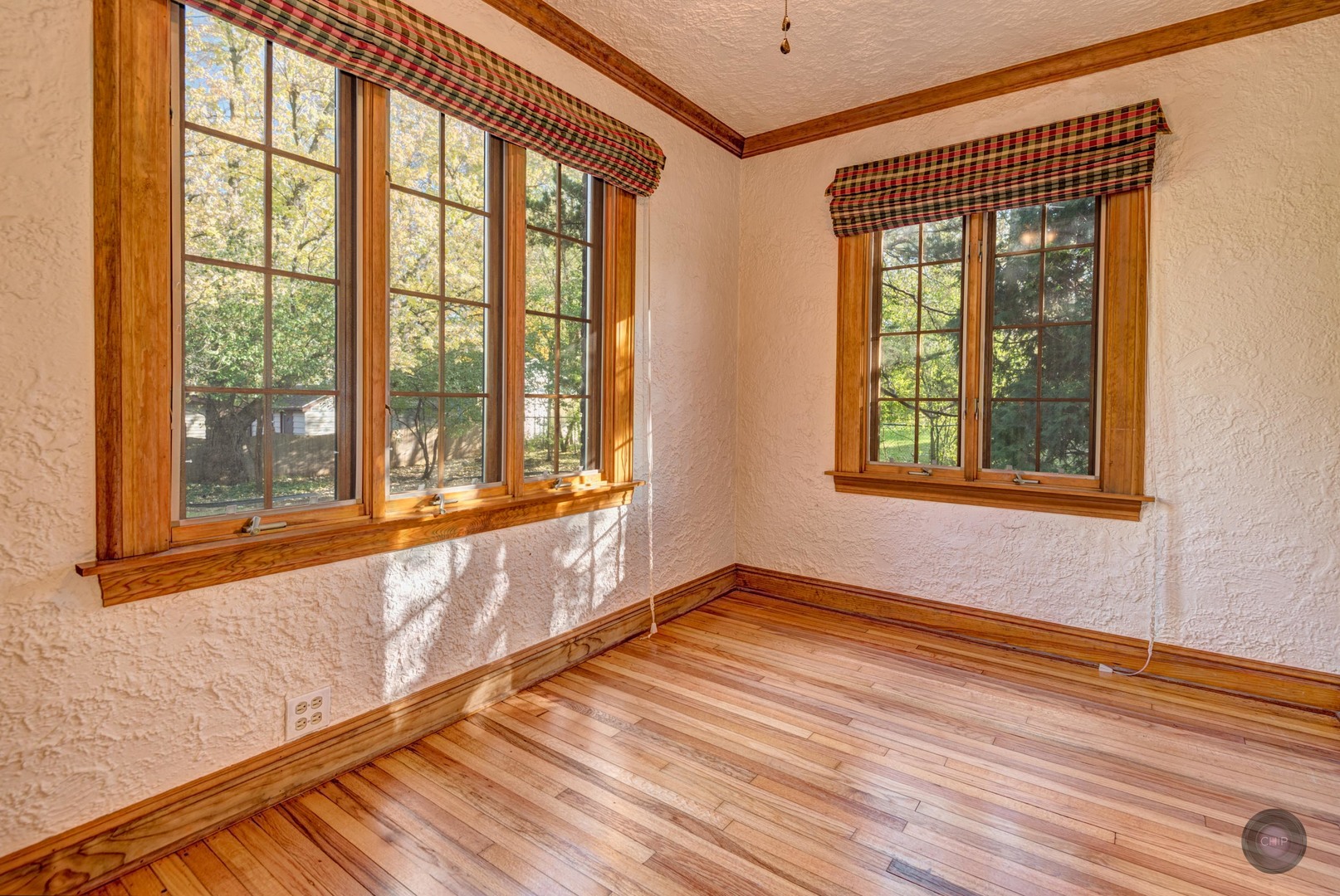 933 North Main Street Glen Ellyn, IL 60137 - Photo 9 of 32 a view of an empty room with wooden floor and a window