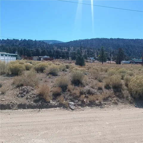 an aerial view of residential house and green space