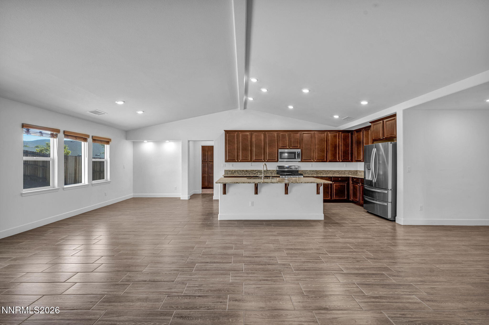 7181 Saddlehorn Road Carson City, NV 89701 - Photo 15 of 62 a room with lots of furniture and a large window