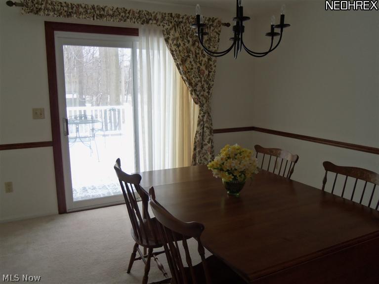 8257 Johnnycake Ridge Road Mentor, OH 44060 - Photo 9 of 25 Formal dining room overlooking deck