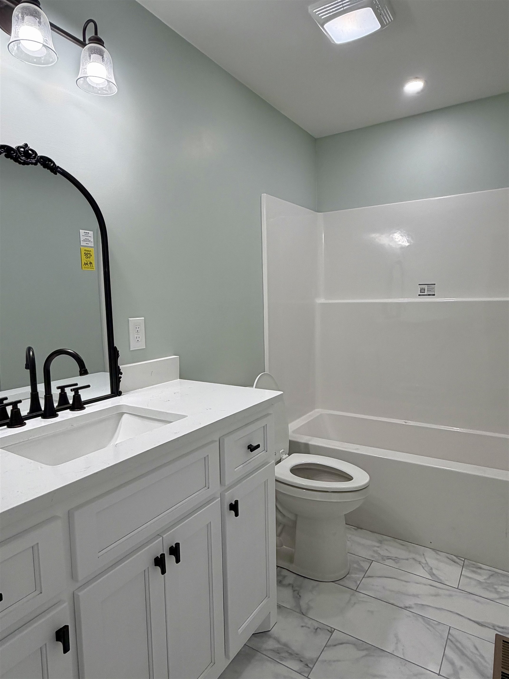 172 New Bethel Road Selmer, TN 38375 - Photo 24 of 30 a bathroom with a sink a toilet and a mirror