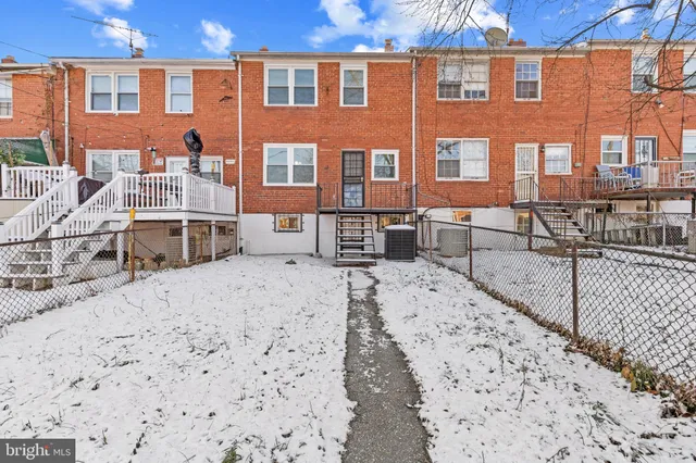 a view of a brick building with many windows