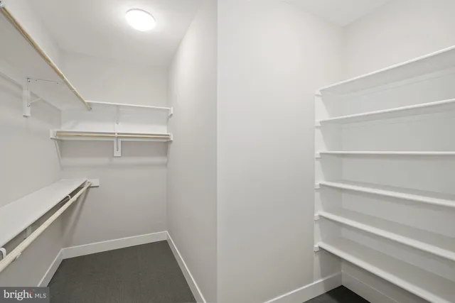 a view of an empty walk in closet