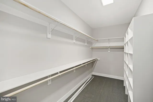 a spacious bathroom with a double vanity sink and a large mirror