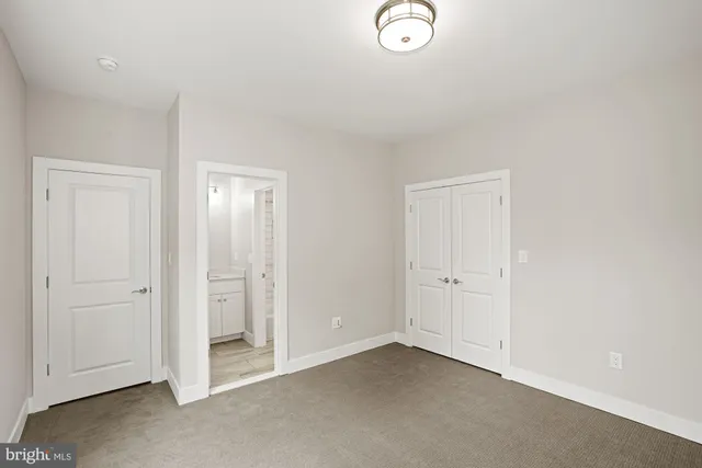 a bathroom with a shower and a sink