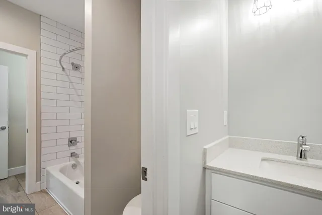 a view of an empty room and closet area