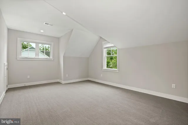 an empty room with closet area