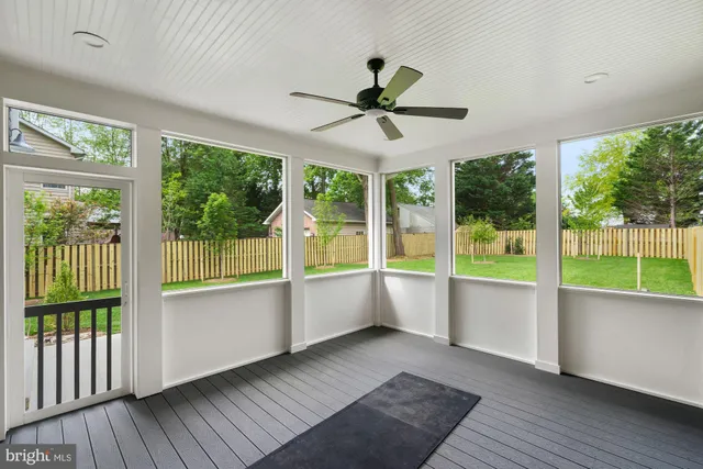 a view of a park with large trees and a plants