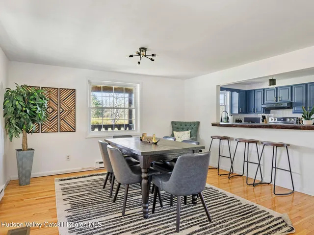 a kitchen with stainless steel appliances granite countertop a sink stove cabinets and wooden floor