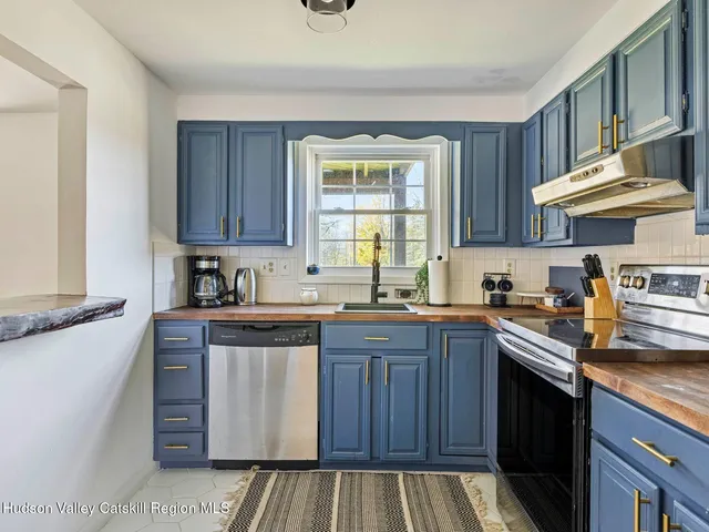 a picture of a room with a white wall and a picture