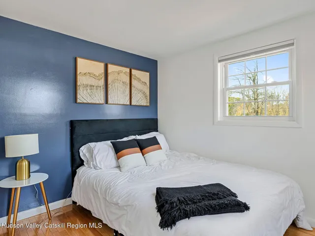 a room with a window and mirror