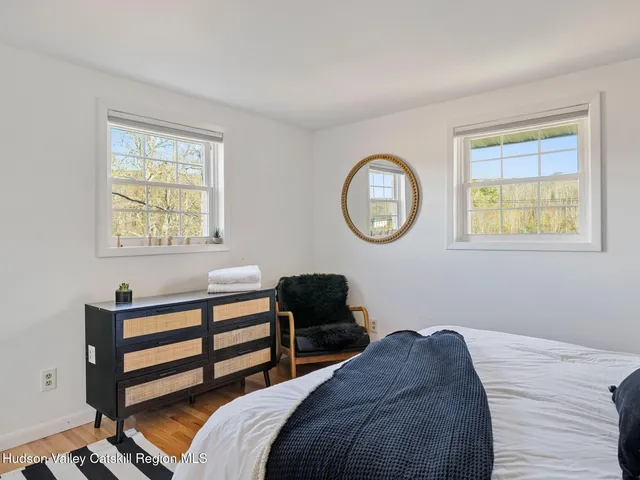 a bedroom with a bed and a bookshelf