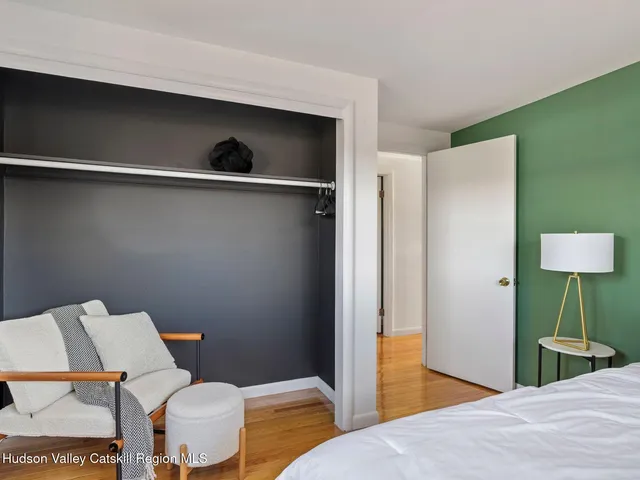 a view of a lush green hillside and houses