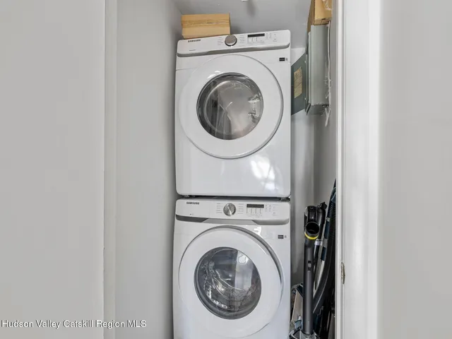 a picture of a room with a white wall and a picture
