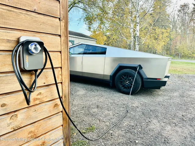 a bedroom with a bed and a dresser in it