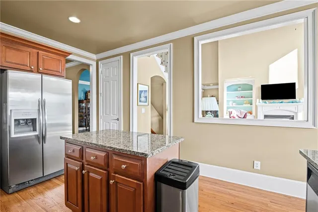 a bedroom with a large bed and a flat screen tv